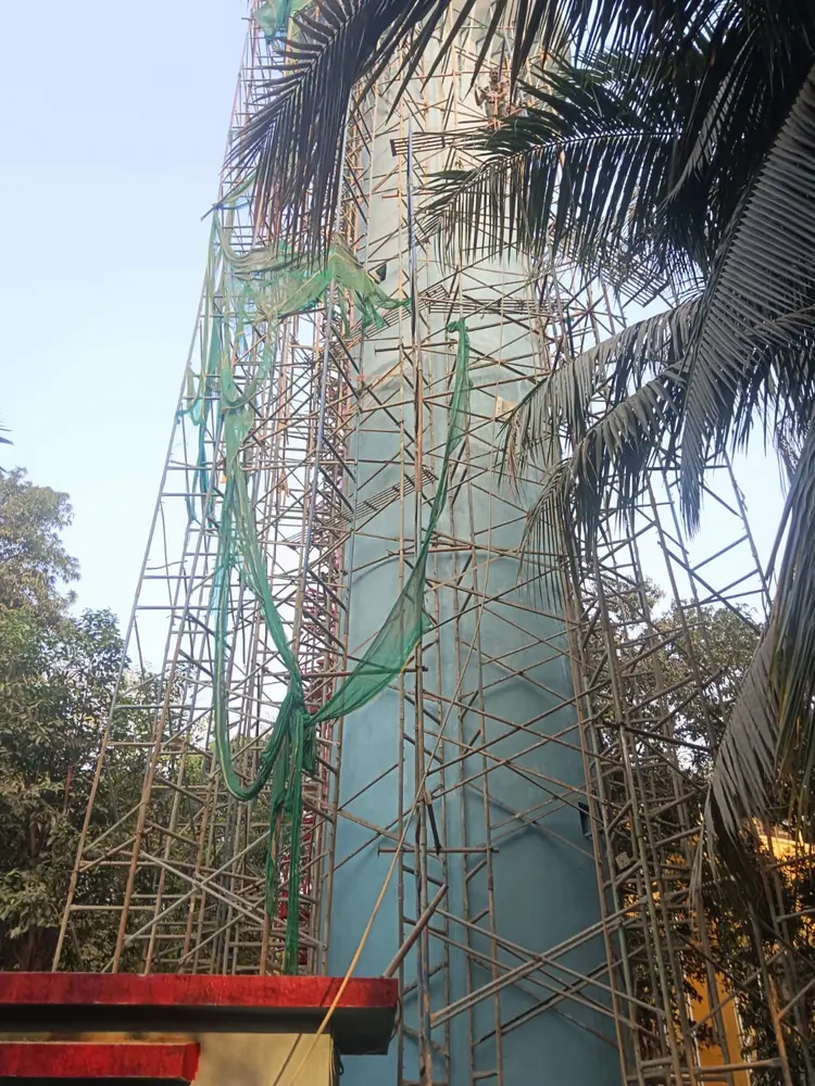 MS H-Frame scaffolding with protective netting on a Mumbai building